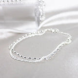 Elegant silver bracelet set with zirconium stones