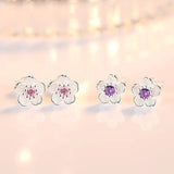 Flower-shaped button earrings with zirconia