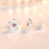 Flower-shaped button earrings with zirconia