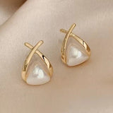 Vintage teardrop earrings with cross and triangle-shaped pearl